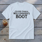 Light blue t-shirt with "Colder Than A Welldigger's Boot" printed in black.