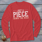 Red long-sleeve shirt with "Just a Piece Down the Road" text.