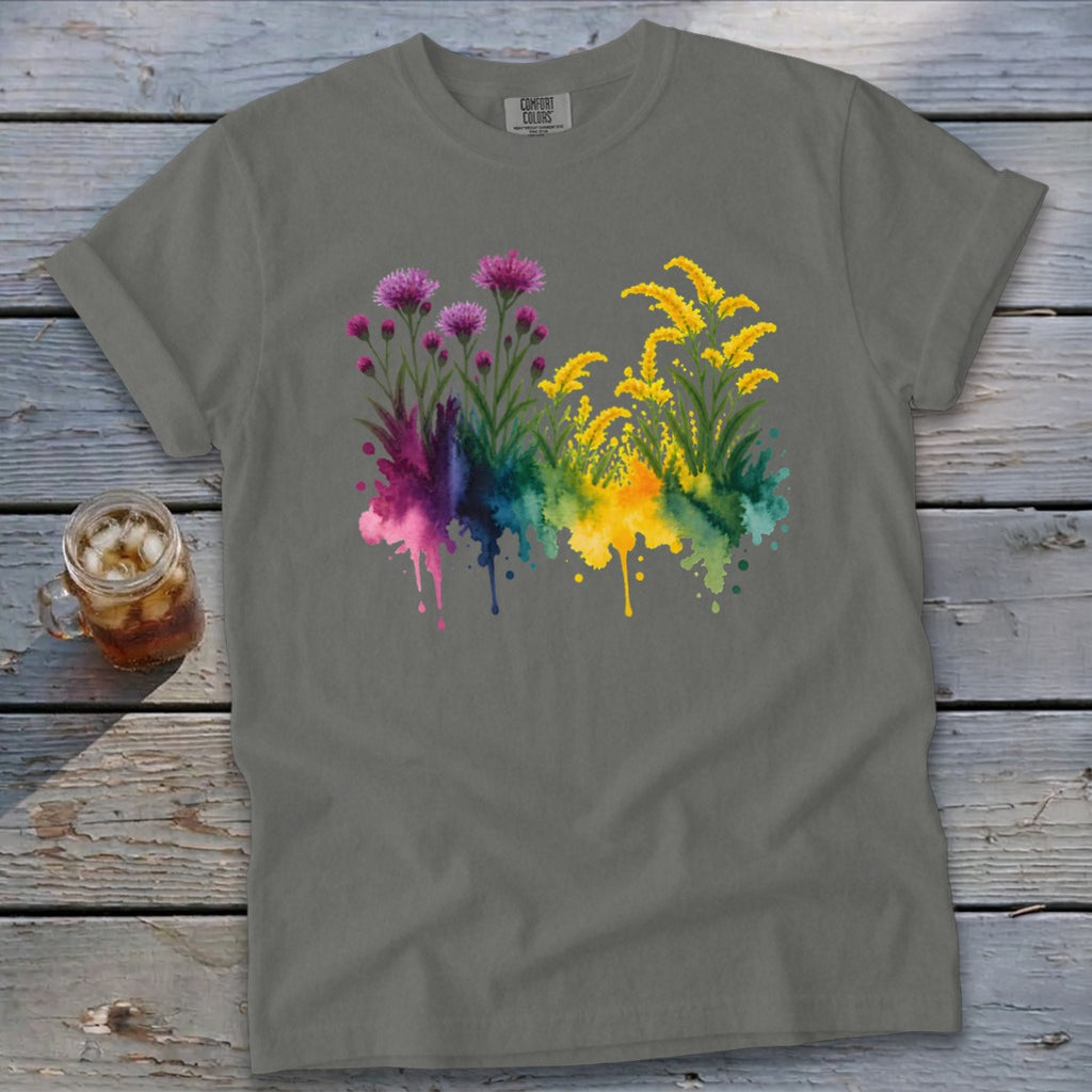 Grey t-shirt with a watercolor floral design of pink thistles and yellow wildflowers.