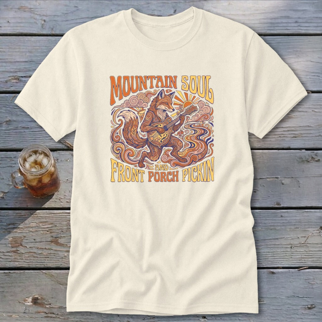 Cream t-shirt with a stylized fox playing a guitar and "Mountain Soul and Front Porch Pickin" text.