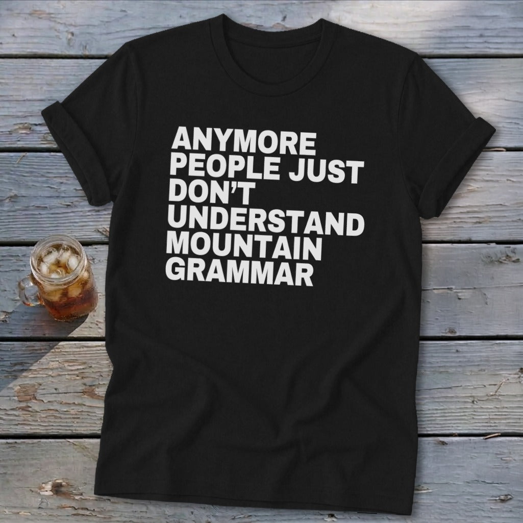 Black t-shirt with white text reading "ANYMORE PEOPLE JUST DON'T UNDERSTAND MOUNTAIN GRAMMAR".