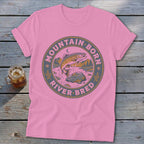 Pink t-shirt with "Mountain Born River Bred" text and leaping trout graphic.