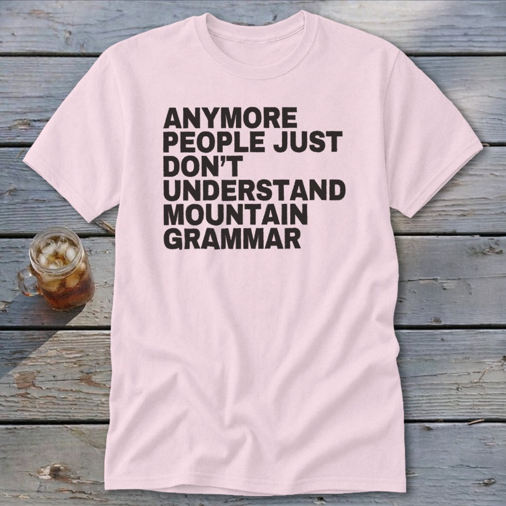 Pink t-shirt with black text reading "anymore people just don't understand mountain grammar".