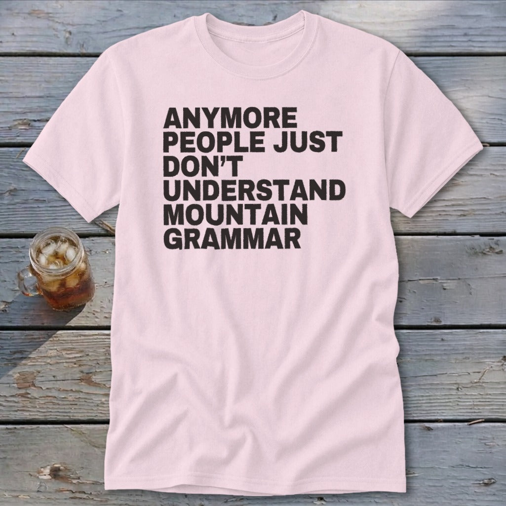 Pink t-shirt with black text reading "anymore people just don't understand mountain grammar".