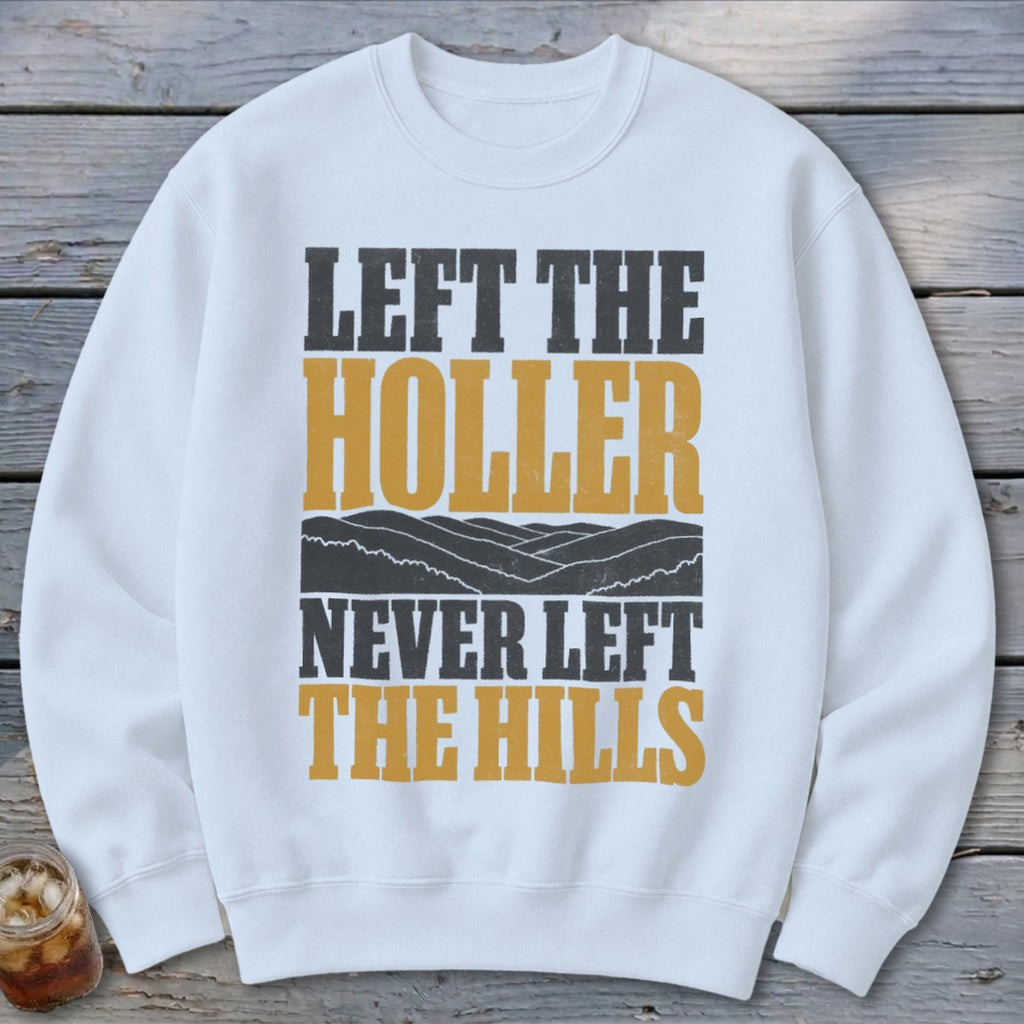 White sweatshirt with text "LEFT THE HOLLER NEVER LEFT THE HILLS".