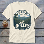 Cream t-shirt with "All Roads Lead to the Holler" text and mountain road graphic.