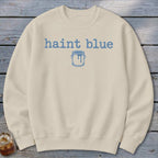 Cream sweatshirt with blue "haint blue" text and paint can graphic.