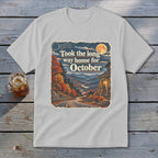 T-shirt with "Took the long way home for October" text and autumn mountain scene.