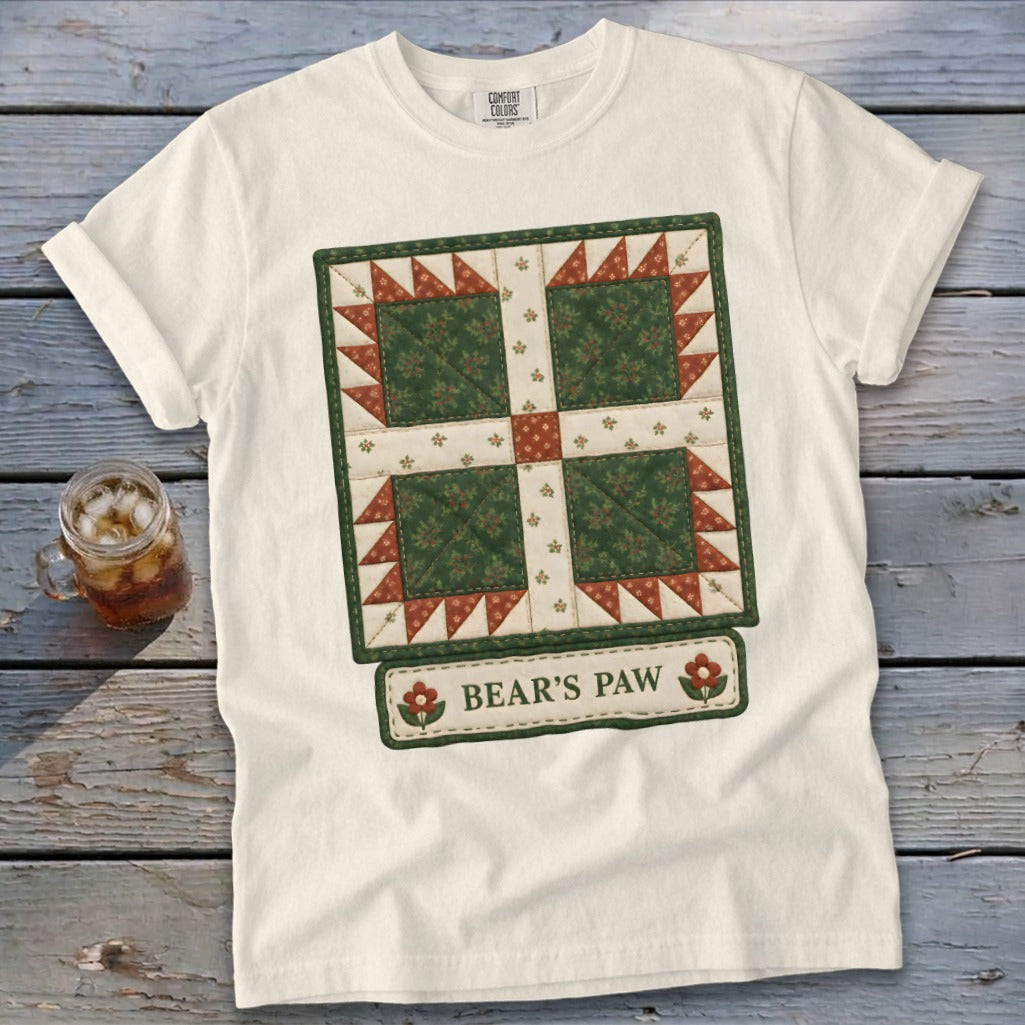 White t-shirt with a quilt block design and "BEAR'S PAW" text.