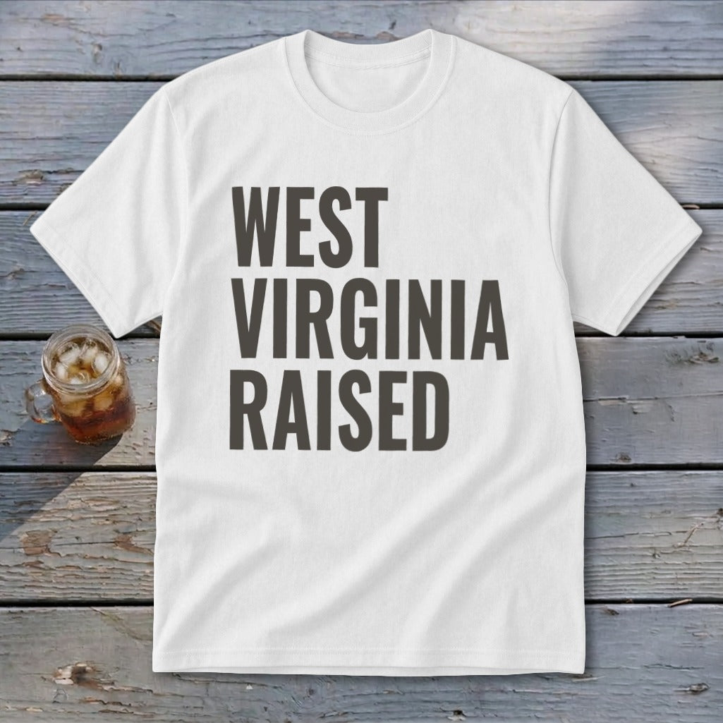 White t-shirt with "WEST VIRGINIA RAISED" printed in dark gray text.
