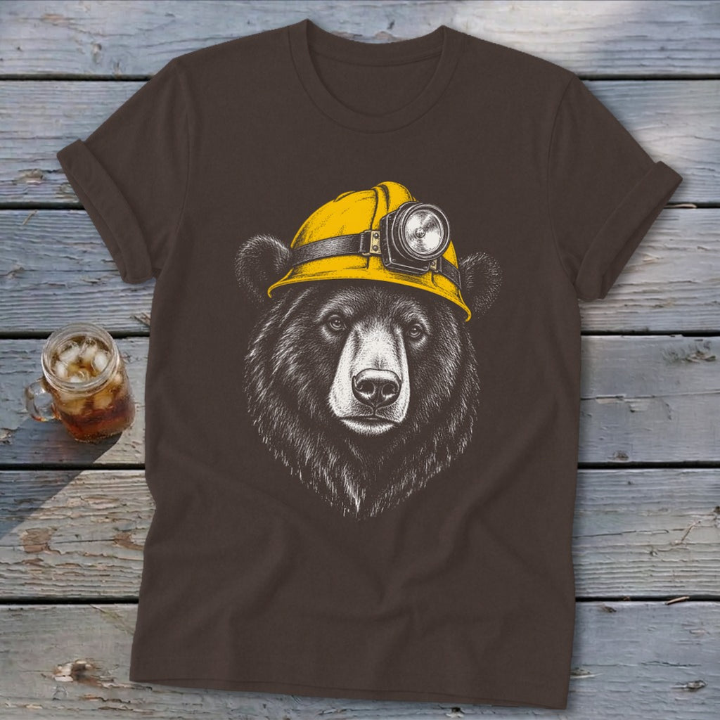 Brown t-shirt with a drawing of a bear wearing a yellow hard hat with a headlamp.