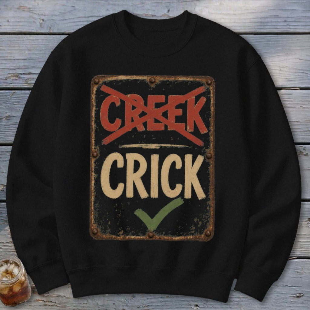 Black sweatshirt with a distressed sign reading "CRICK" with "CREEK" crossed out.