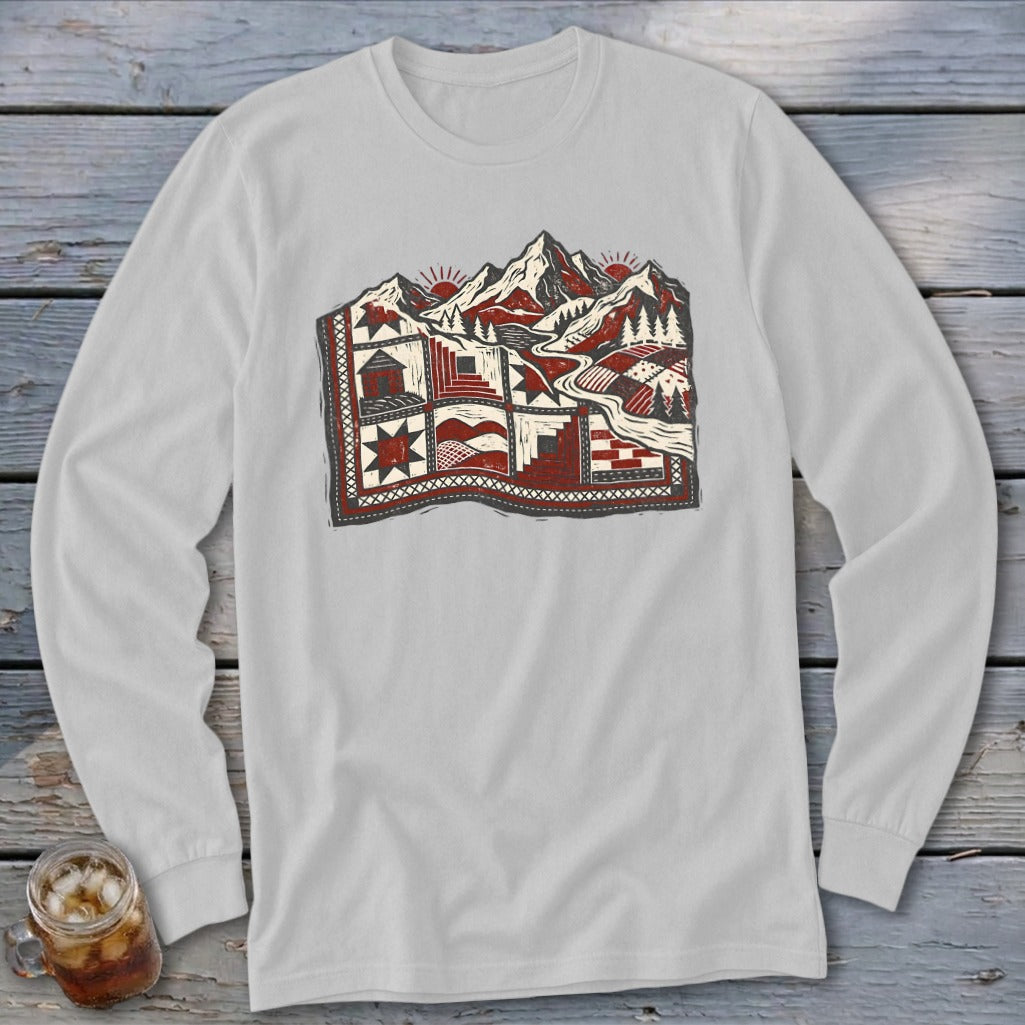 Light gray long-sleeve t-shirt with a red and black landscape graphic featuring mountains, trees, and geometric quilt patterns.