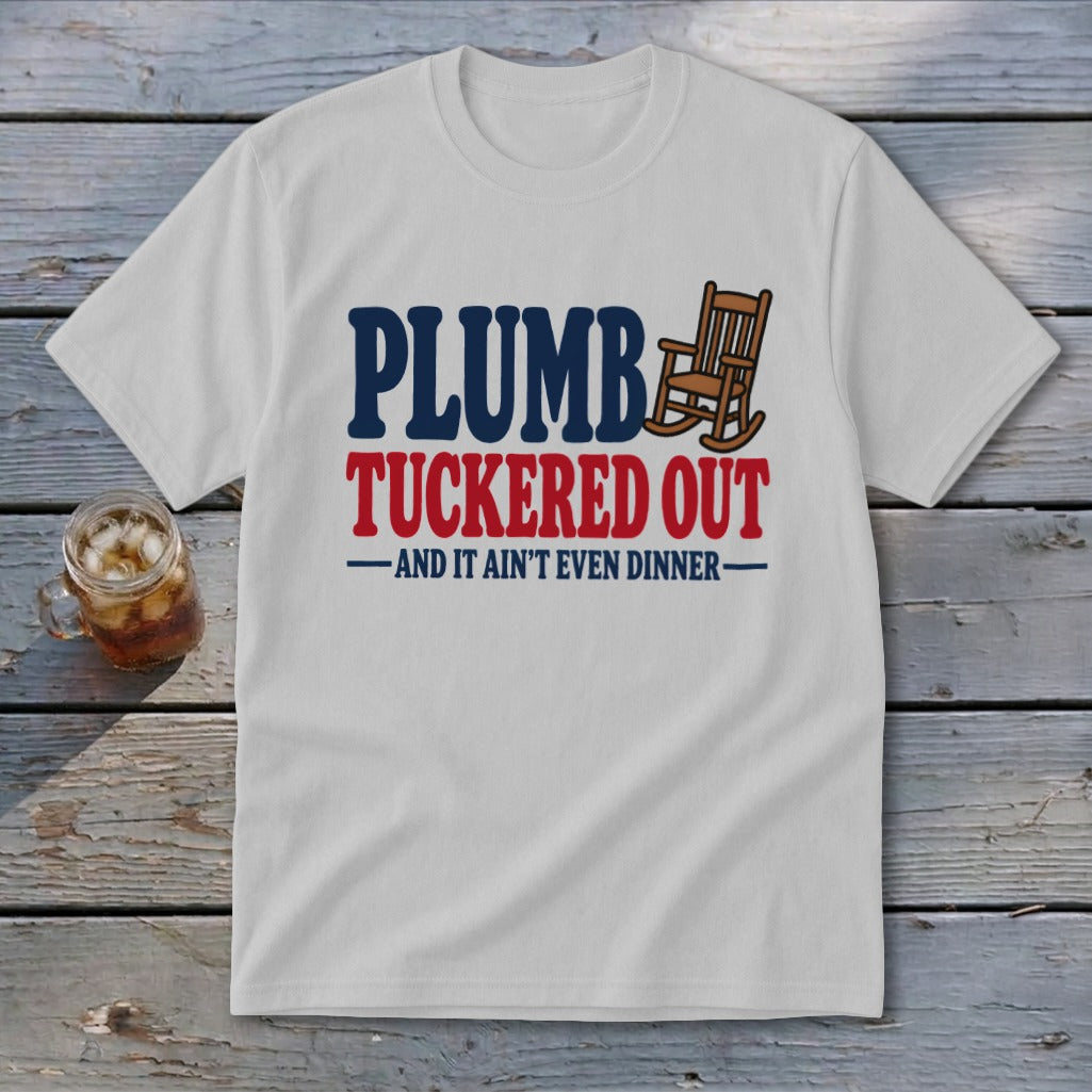 White t-shirt with "PLUMBER TUCKERED OUT" and rocking chair graphic.