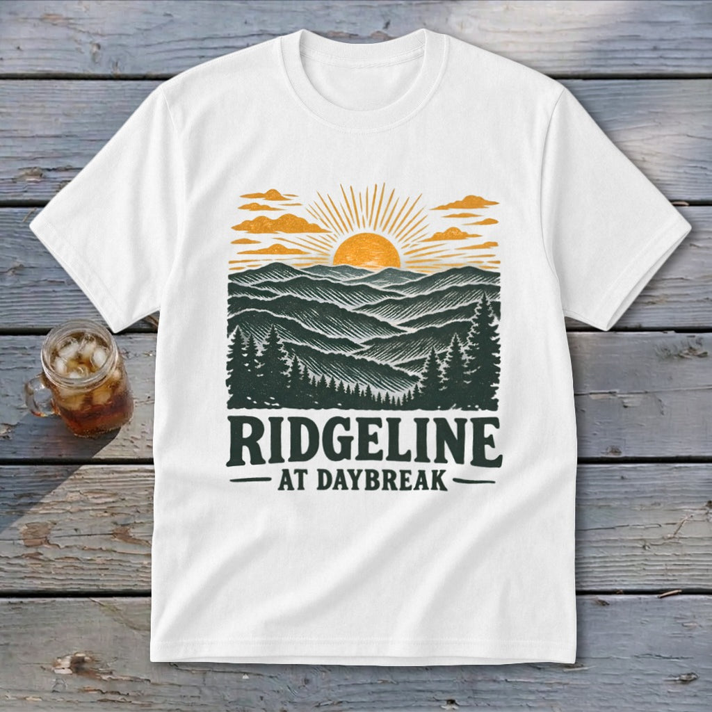 White t-shirt with a Ridgeline at Daybreak landscape graphic.