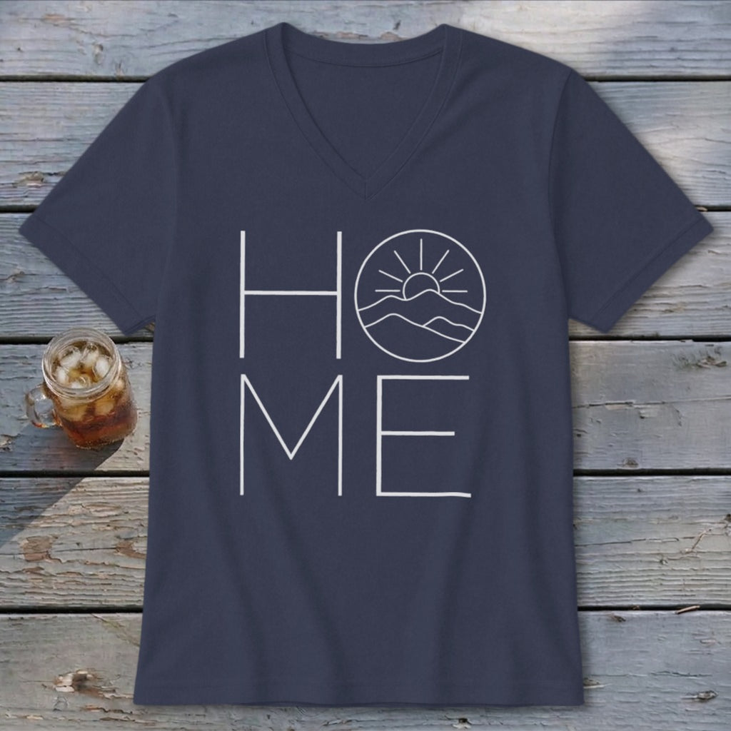 A dark blue V-neck t-shirt with a white graphic spelling "HOME," featuring a mountain and sun design inside the letter O.