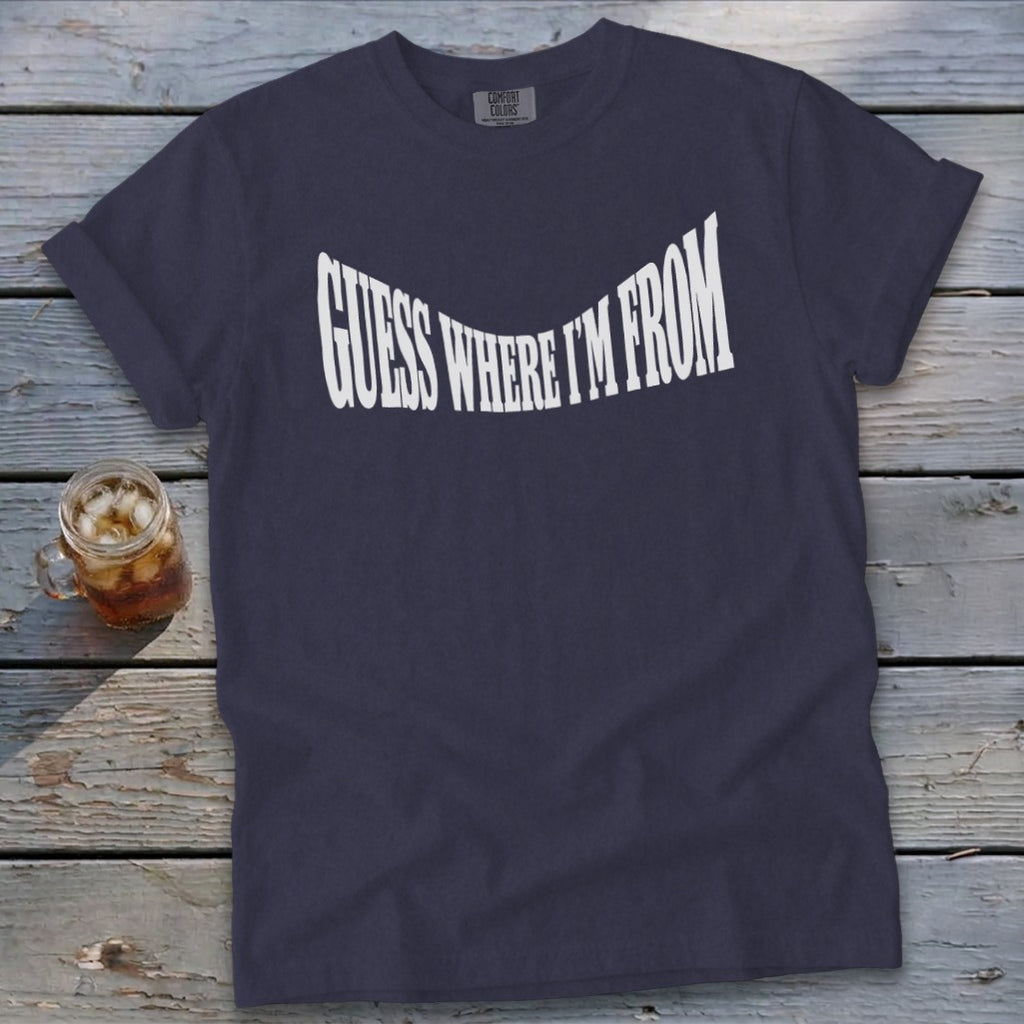 Navy t-shirt with white text that reads "GUESS WHERE I'M FROM"