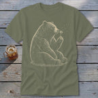 T-shirt with a sketch of a bear blowing dandelion seeds.