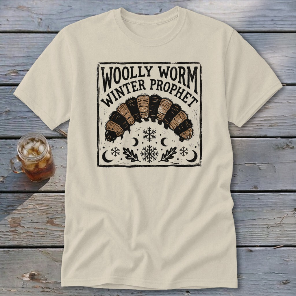 Off-white t-shirt featuring a black and brown graphic of a woolly worm with text reading Woolly Worm Winter Prophet.