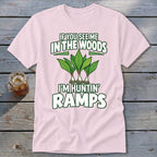 A light pink t-shirt with green text reading IF YOU SEE ME IN THE WOODS I'M HUNTIN RAMPS and an illustration of ramps.