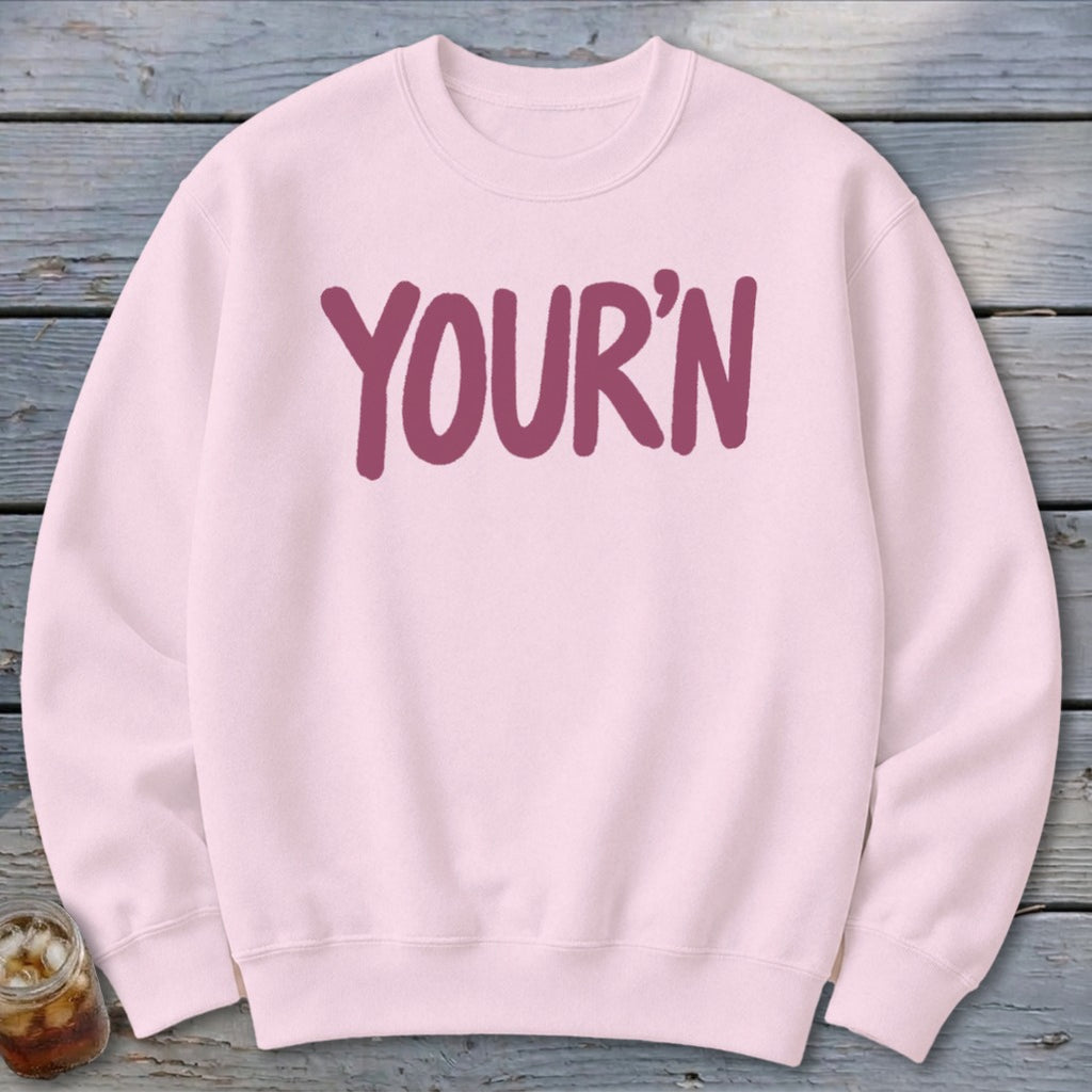 Light pink sweatshirt with maroon "YOUR'N" text on the front.