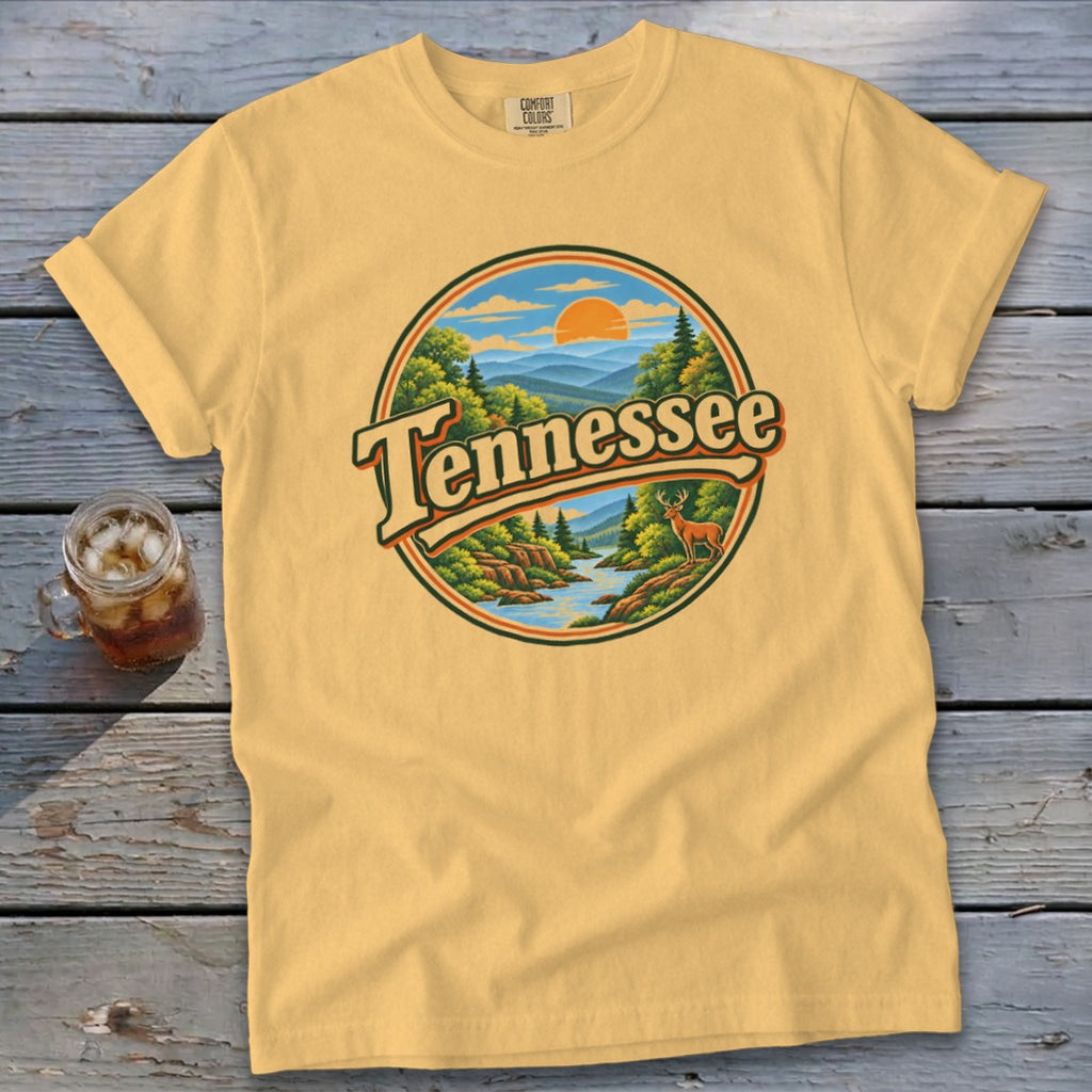 Yellow t-shirt with a circular graphic of a Tennessee landscape with deer and river.