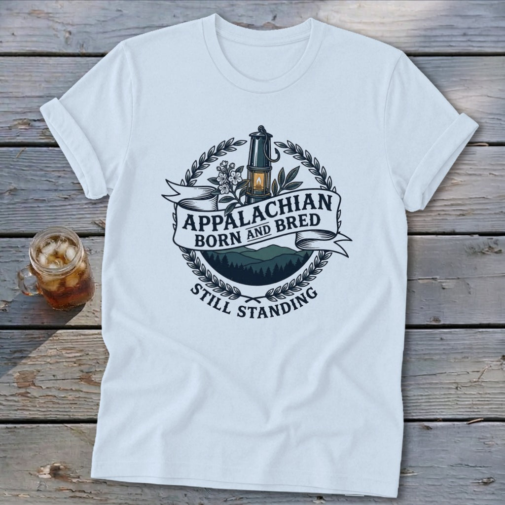 White t-shirt with "Appalachian Born and Bred Still Standing" text and mountain graphic.