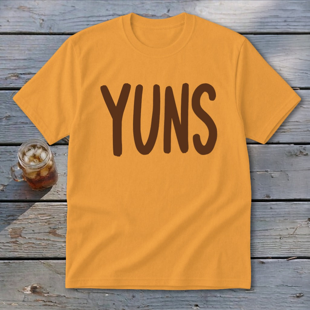 Orange t-shirt with brown text that reads "YUNS" and a glass of iced tea.