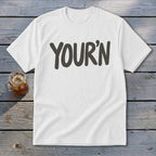 White t-shirt with "YOUR'N" printed in dark gray text.