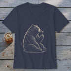Bear blowing on a dandelion on a navy v-neck t-shirt.