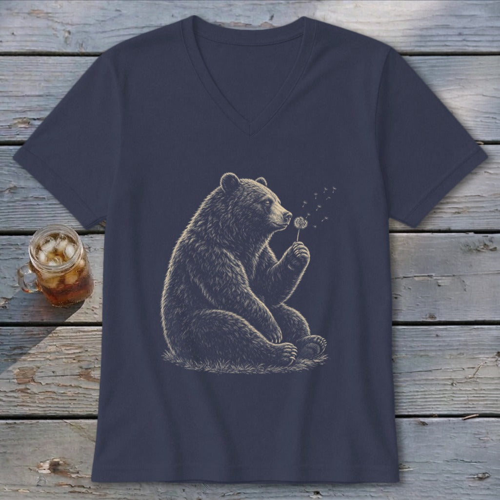Bear blowing on a dandelion on a navy v-neck t-shirt.