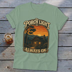 T-shirt graphic: "The Porch Light is Always On" with cabin at sunset.