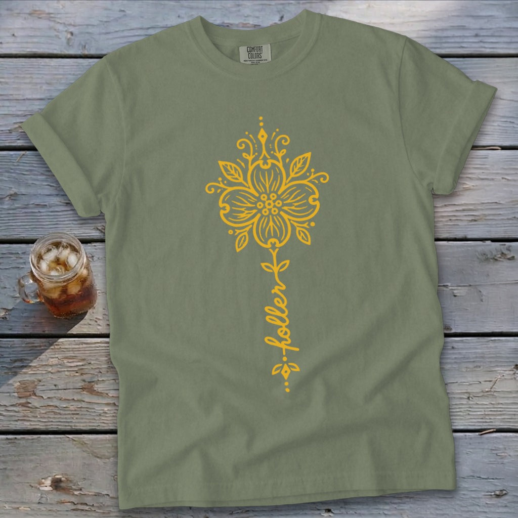 Olive green t-shirt with yellow floral design and text "...holler".