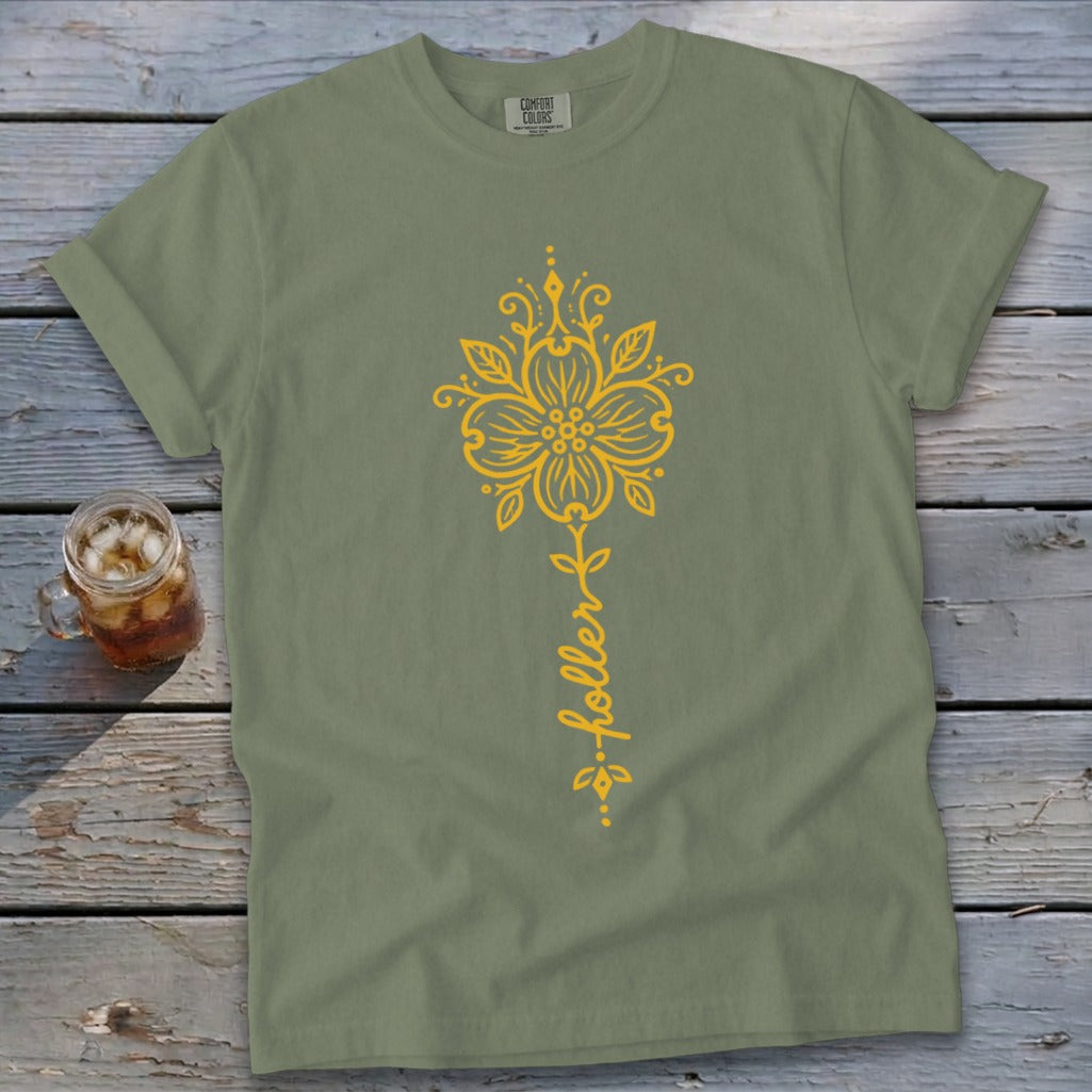 Olive green t-shirt with yellow floral design and text "...holler".
