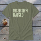 Olive t-shirt with "MISSISSIPPI RAISED" in light green text.
