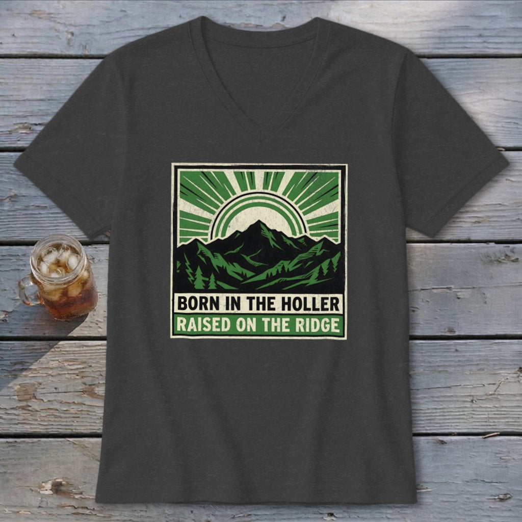 Charcoal v-neck t-shirt featuring a green and black mountain graphic with text that reads born in the holler raised on the ridge.
