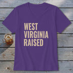 Purple v-neck t-shirt with "West Virginia Raised" text in beige.