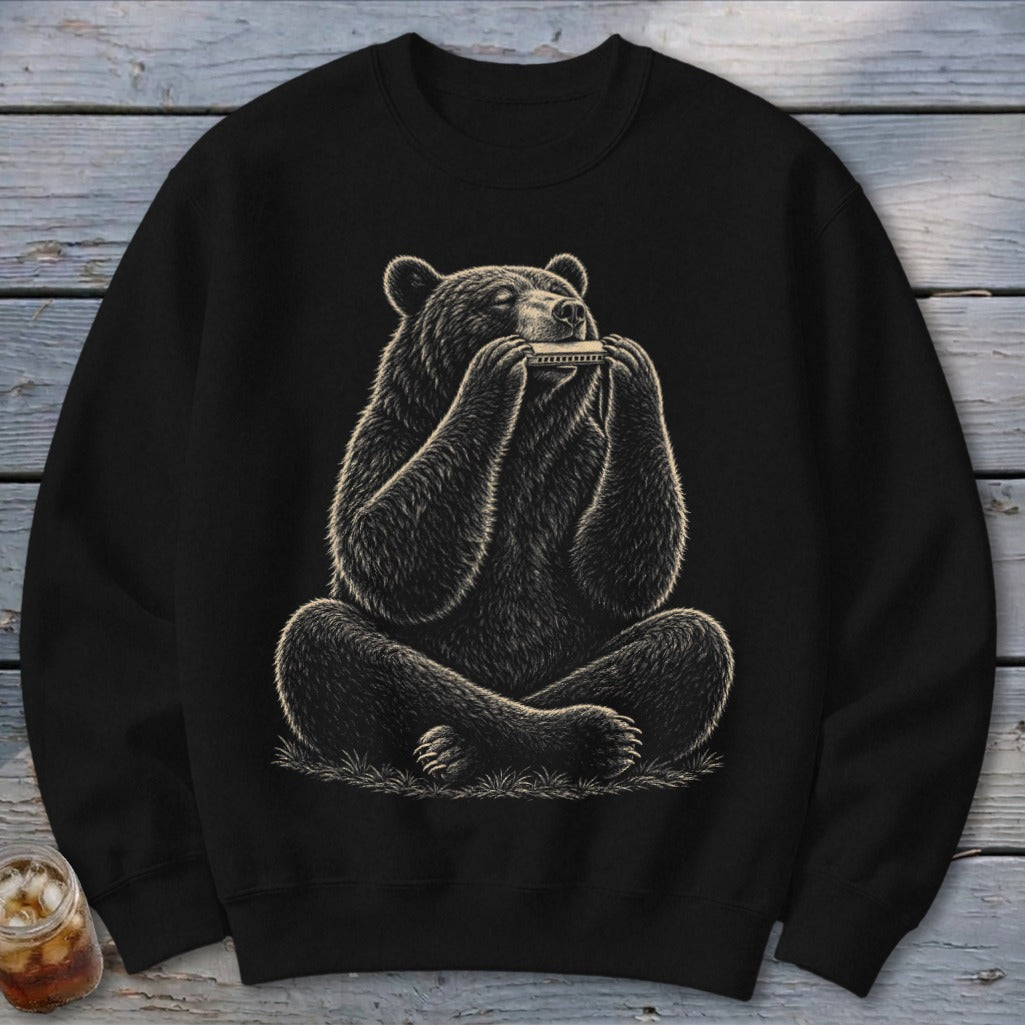 Black sweatshirt with a seated bear playing a harmonica with detailed fur.