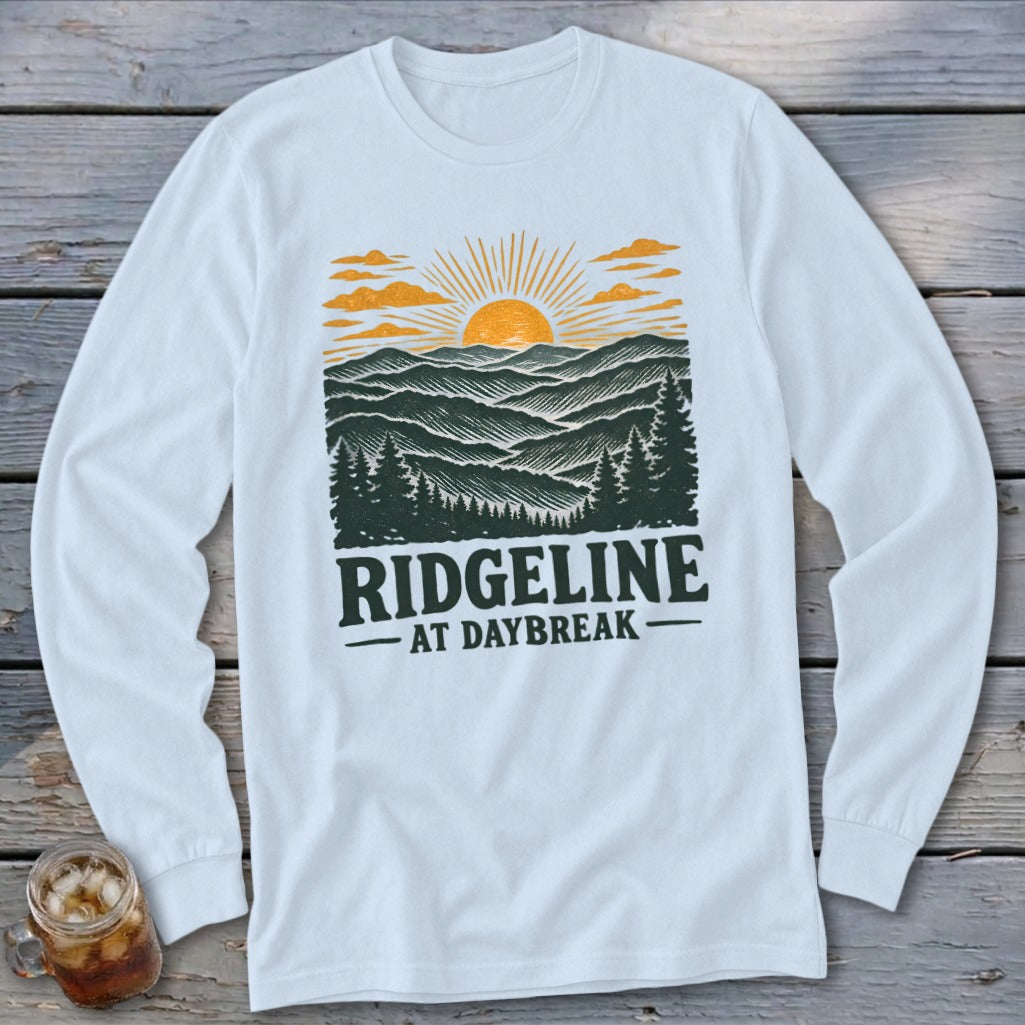 White long-sleeve shirt with "RIDGELINE AT DAYBREAK" graphic of mountains at sunrise.