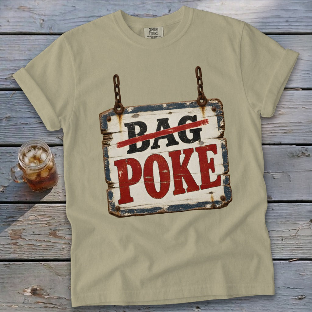 A beige t-shirt featuring a hanging wooden sign graphic with crossed-out text reading Bag Poke.