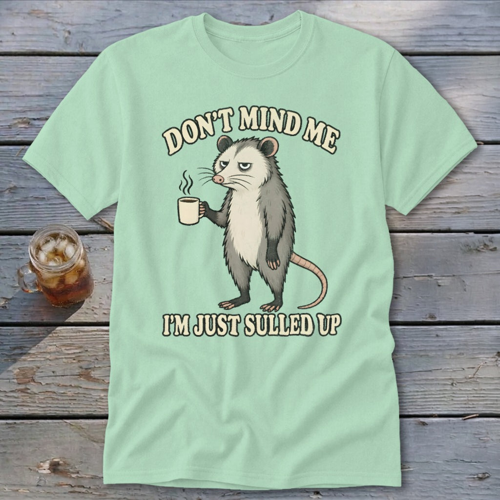 Opossum with coffee mug and text "DON'T MIND ME I'M JUST SULLED UP".