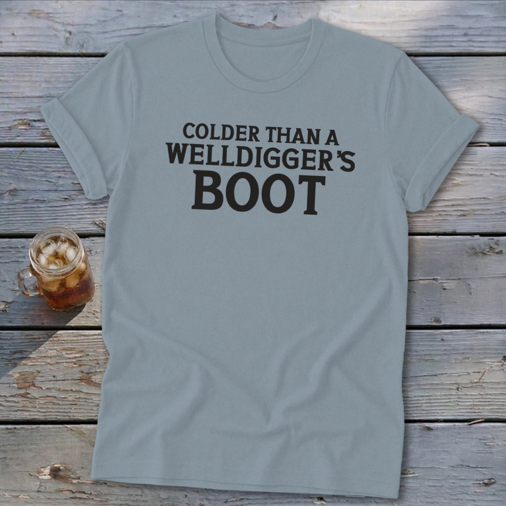 Grey t-shirt with "Colder than a welldigger's boot" text and iced beverage.