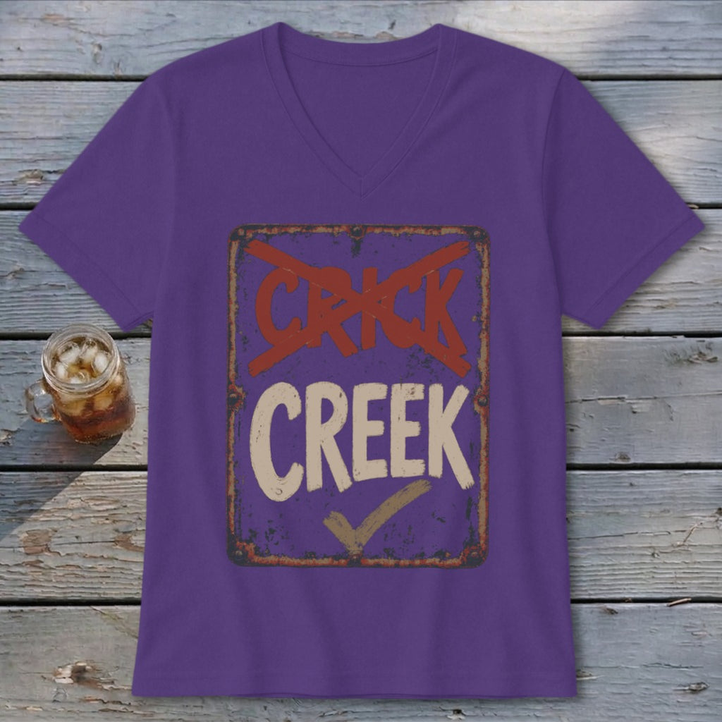 Purple v-neck t-shirt with a distressed sign graphic saying "CRICK" with a red X through it and "CREEK" with a checkmark.