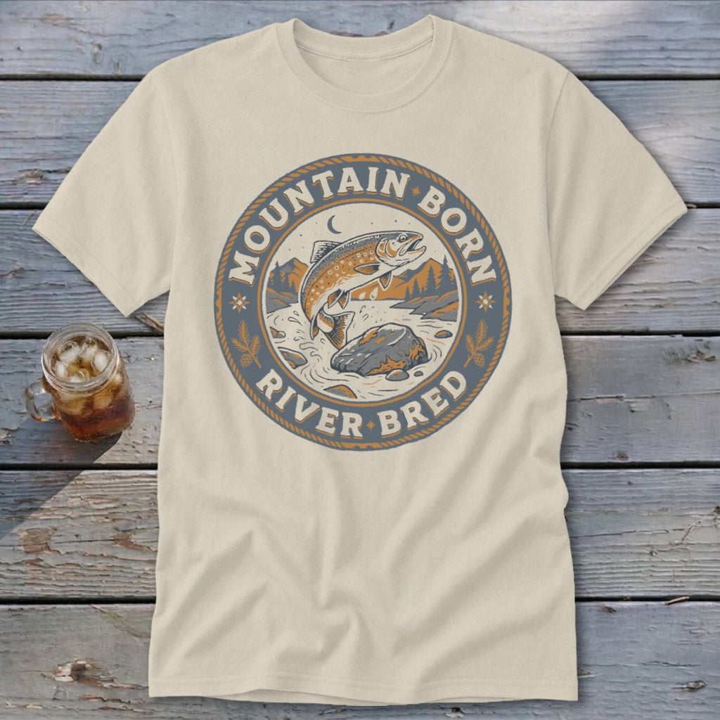 Light beige t-shirt with circular graphic of jumping trout and text "Mountain Born River Bred".