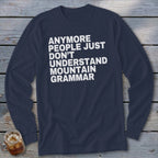 Navy long sleeve shirt with white text: "Anymore people just don't understand mountain grammar."