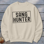 Cream crewneck sweatshirt with black text that reads "SANG HUNTER".