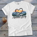 White t-shirt with mountain sunset graphic and "Appalachia Strong" text.