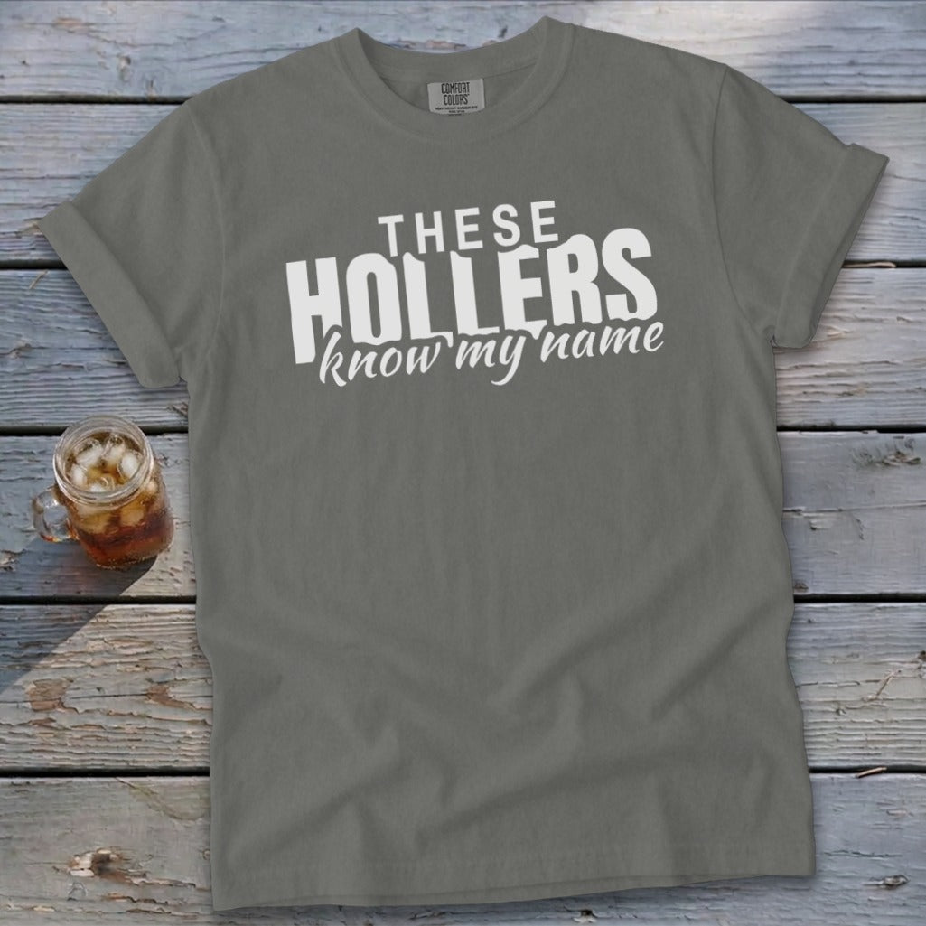 Gray t-shirt with white text "THESE HOLLERS know my name"