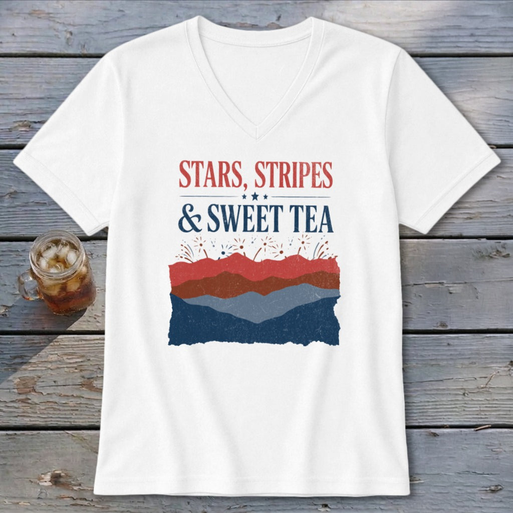A white V-neck t-shirt featuring the text "STARS, STRIPES & SWEET TEA" above a red, white, and blue mountain graphic.