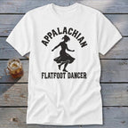 A white t-shirt featuring a black silhouette of a dancer with Appalachian Flatfoot Dancer text.